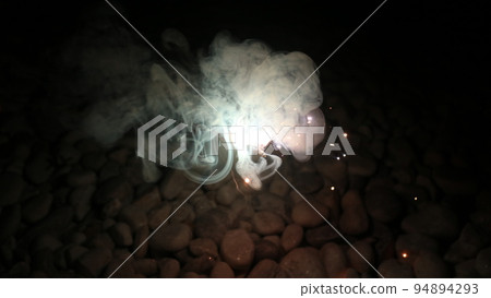 handheld fireworks at night 94894293