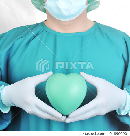 Surgeon holding a green hearth 94896090