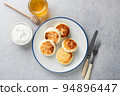 Syrniki, sweet curd cheese or ricotta cheese fritters 94896447