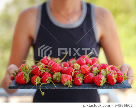 Fresh organic strawberries , over dark background 94896602