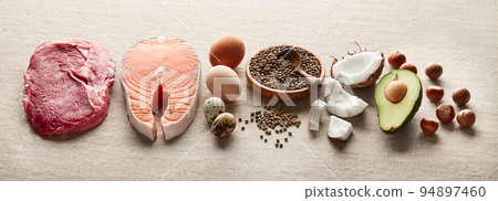 Healthy food for keto diet on sandy background Healthy food for keto diet on sandy background 94897460