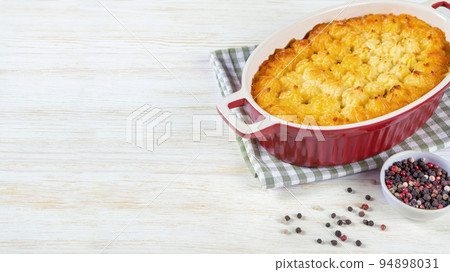 Shepherd's Pie or Cottage Pie, traditional British dish on white wooden background 94898031