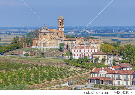 View of the village church of Camino in the Italian province of Piedmont 94898390