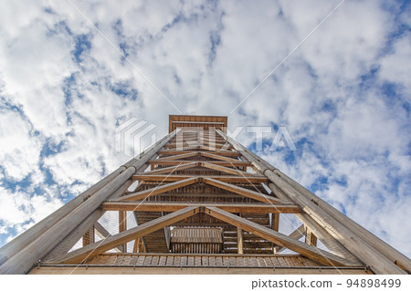 Vertical image of Goethe Tower structure in Frankfurt against blue sky 94898499