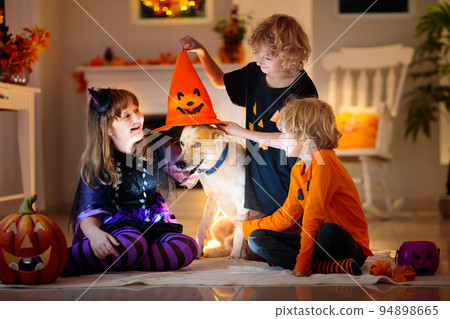 Kids in witch costume on Halloween trick or treat Kids in witch costume on Halloween trick or treat 94898665