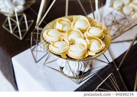 Delicious wedding reception candy bar dessert table 94899234
