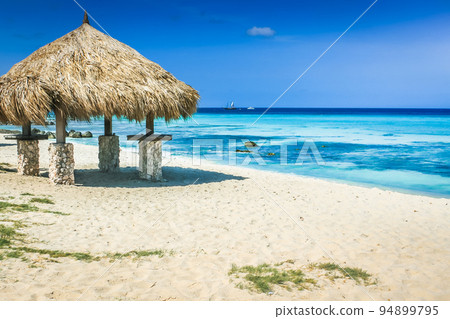 Aruba Arashi caribbean beach with palapa, Dutch Antilles, Caribbean Sea 94899795