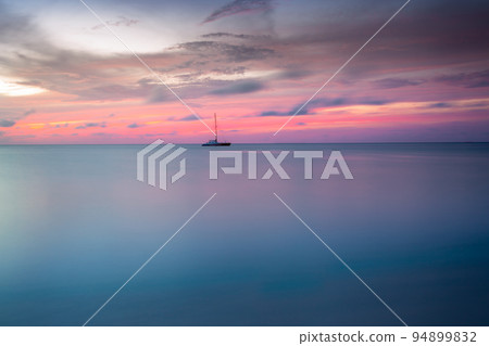 Aruba idyllic caribbean beach with boats at sunset, Dutch Antilles Sea Aruba idyllic caribbean beach with boats at sunset, Dutch Antilles Sea 94899832