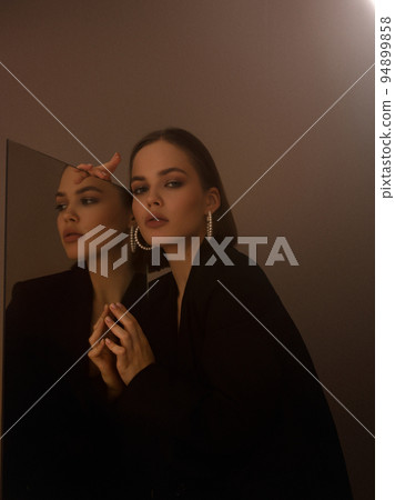 Fashion photography. A beautiful girl in a black 94899858