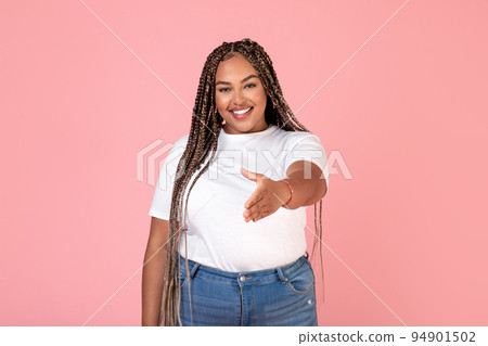 Cheerful African Lady Stretching Hand For Handshake Greeting, Pink Background Cheerful African Lady Stretching Hand For Handshake Greeting, Pink Background 94901502