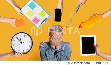 Overwhelmed mature woman having difficulties with time management Overwhelmed mature woman having difficulties with time management 94901564