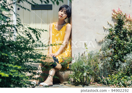 woman wearing a yellow dress 94902292