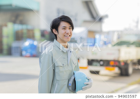 A young man working on clothes 94903597