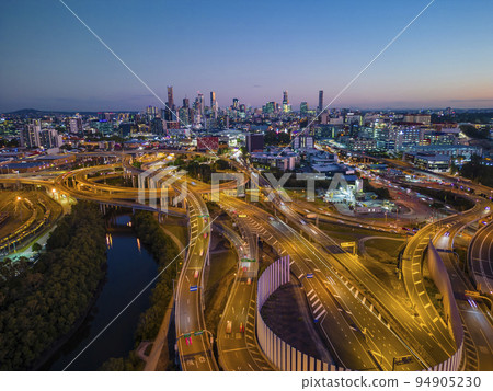 Aerial view of Brisbane city and highway traffic in Australia at night 94905230