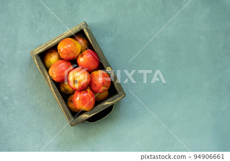 Ripe red apples in wooden box. Top view with space for your text Ripe red apples in wooden box. Top view with space for your text 94906661
