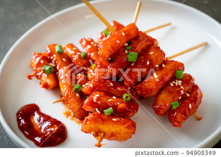deep fried Korean rice cake (Tteokbokki) skewered with spicy sauce 94908349