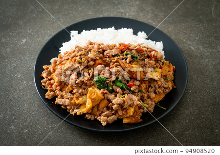 stir-fried minced pork with basil and egg topped on rice stir-fried minced pork with basil and egg topped on rice 94908520