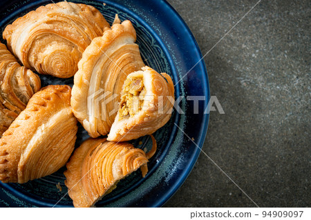 curry puff stuffed chicken on plate curry puff stuffed chicken on plate 94909097