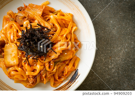 stir-fried udon noodles with kimchi and pork stir-fried udon noodles with kimchi and pork 94909203