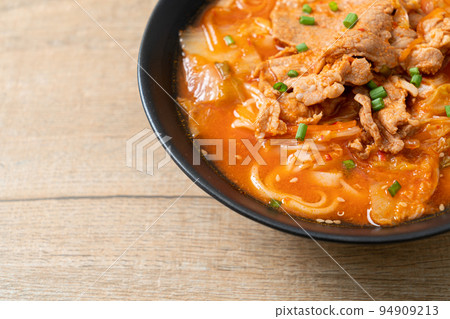 Korean udon ramen noodles with pork in kimchi soup Korean udon ramen noodles with pork in kimchi soup 94909213
