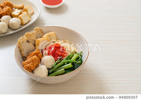egg noodles with fish balls and shrimp balls in pink sauce, Yen Ta Four or Yen Ta Fo egg noodles with fish balls and shrimp balls in pink sauce, Yen Ta Four or Yen Ta Fo 94909307