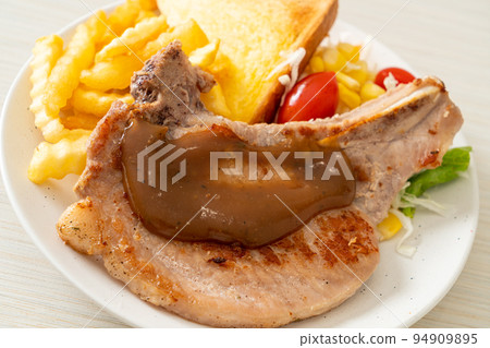 pork chop steak with chips and mini salad pork chop steak with chips and mini salad 94909895
