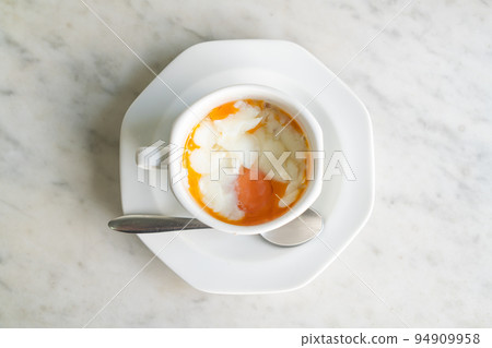 Soft-boiled eggs in white cup 94909958