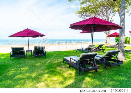 beach chair and umbrella with sea beach background beach chair and umbrella with sea beach background 94910054