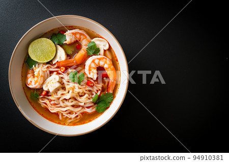 instant noodles ramen in spicy soup with shrimps (Tom Yum Kung) 94910381