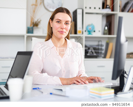 Young woman working at office alone 94911654