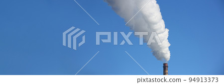 Chimney blows white smoke into blue sky Chimney blows white smoke into blue sky 94913373