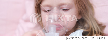 Little girl making inhalation of medicine for cough treatment Little girl making inhalation of medicine for cough treatment 94913441