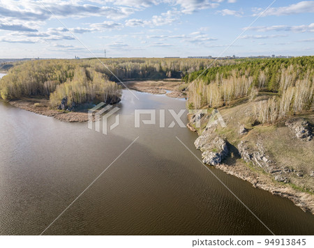 Confluence of the Iset and Kamenka rivers in the city Kamensk-Uralskiy. Iset and Kamenka rivers, Kamensk-Uralskiy, Sverdlovsk region, Ural mountains, Russia. Aerial view 94913845