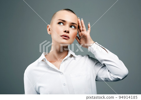 young woman with short haircut. portrait of beautiful bald woman 94914185