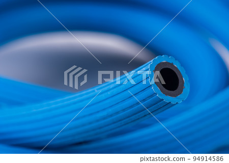 Hose for conveying oxygen in industrial applications, close-up Hose for conveying oxygen in industrial applications, close-up 94914586