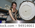 Beautiful woman making ceramic pottery on wheel, close-up. woman in freelance, business, hobby. 94914661