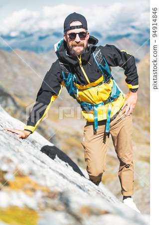 Portrait of young male explorer in the mountains 94914846