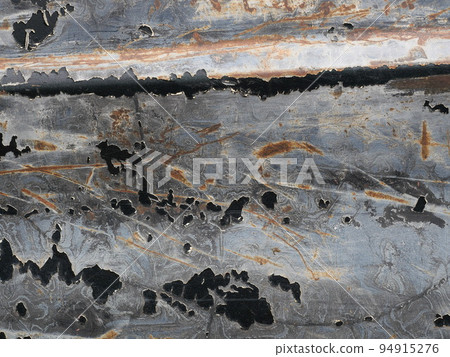 Brown rust stain on the black with blue with green with gray and silver color surface of the sheet metal , Cracked and flaking surfaces, Abstract background and metalic texture Brown rust stain on the black with blue with green with gray and silver color surface of the sheet metal , Cracked and flaking surfaces, Abstract background and metalic texture 94915276
