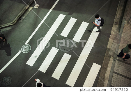 crosswalk and people at night 94917230