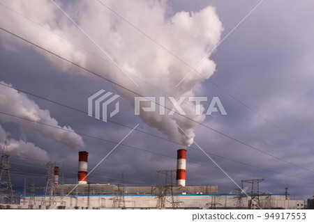 Large wide smoking chimneys. Picture of air pollution. Ecological catastrophy 94917553