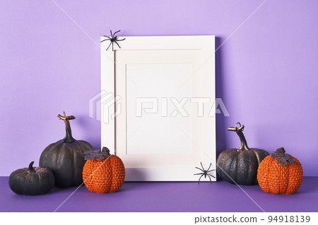 Halloween composition with black pumpkins on violet background. Greeting card template, Halloween decorations 94918139