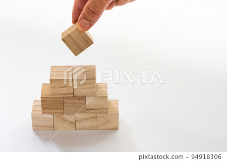Stacking wooden blocks by hand Stacking wooden blocks by hand 94918306