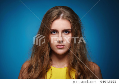 lovely woman with strong healthy curly hair 94918353