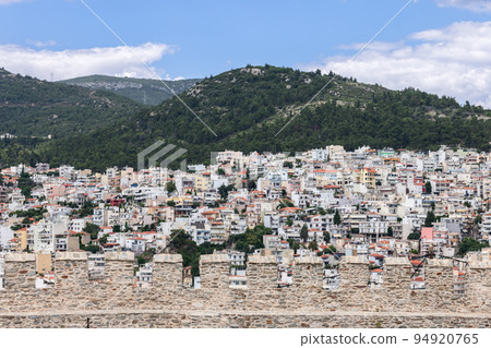 Kavala chaotic urban residential development on a forested hill through the battlements of castle Kavala chaotic urban residential development on a forested hill through the battlements of castle 94920765