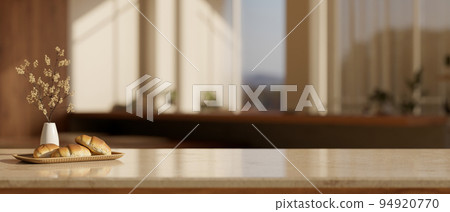 Luxury tabletop with bread on a tray, ceramic flower vase and empty space over blurred living room 94920770