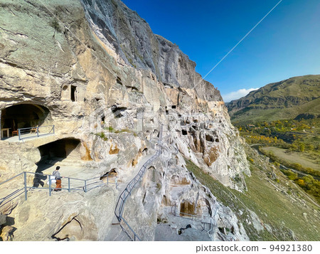 Exterior of aged cave monastery 94921380