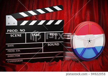 Luxembourgish cinematography, film industry, cinema in Luxembourg. Clapperboard with and film reels on the red fabric, 3D rendering 94922058