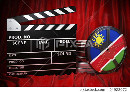 Namibian cinematography, film industry, cinema in Namibia. Clapperboard with and film reels on the red fabric, 3D rendering 94922072