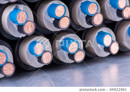 Copper Electrical Cable on Metallic Surface Close-up Copper Electrical Cable on Metallic Surface Close-up 94922961