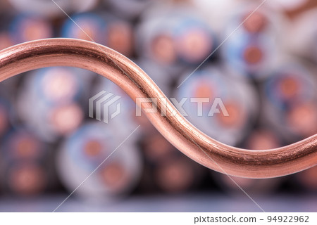 Macro detail of copper wire on blurred background Macro detail of copper wire on blurred background 94922962